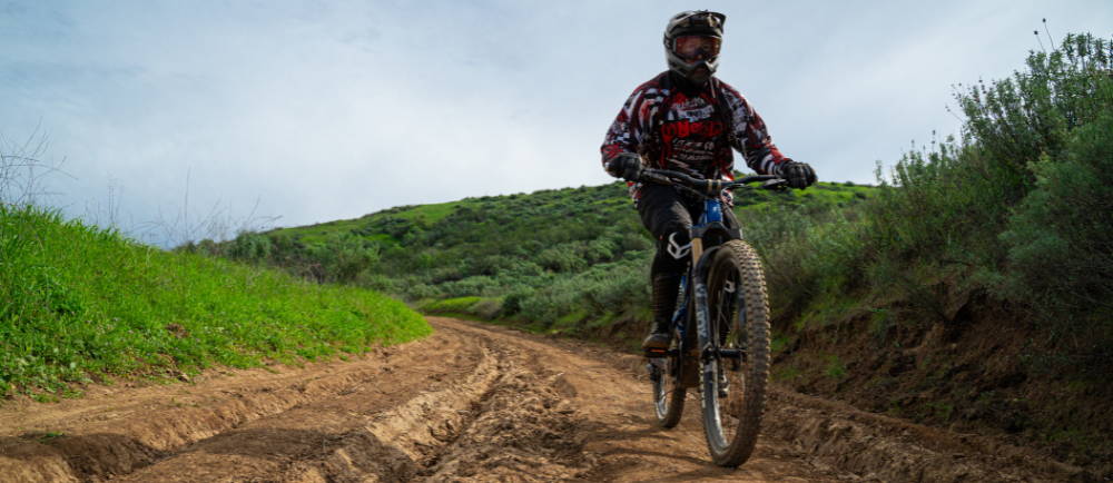 A e-MTB coming down a dirt road