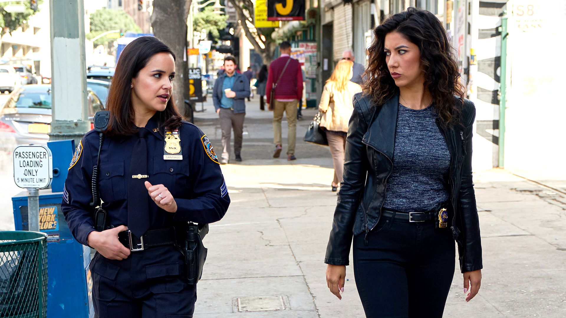 Rosa and Amy walking in the street having a tense conversation. Rosa is glaring at Amy.