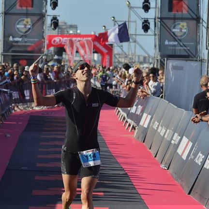 Crossing the finish line at Ironman Italy