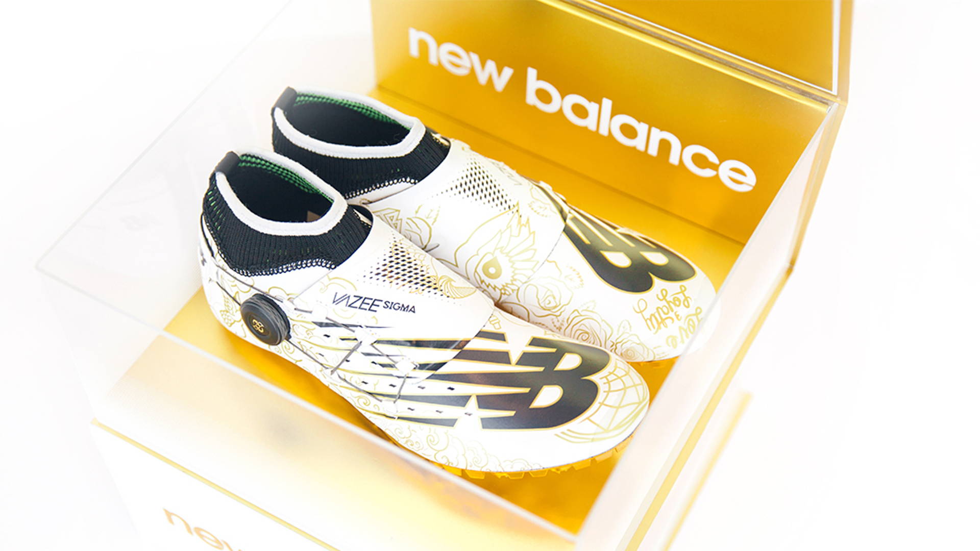 white and gold new balance spikes