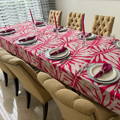 printed rectangular tablecloth with white leaves over a red background