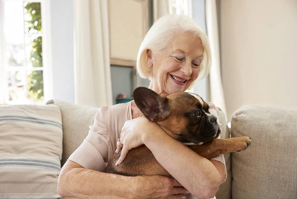 Grandmother holding a dog