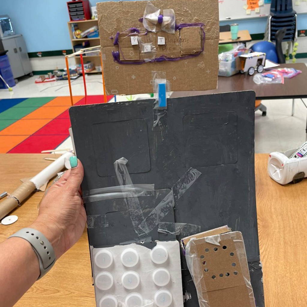 closeup photo of student cardboard model for class project