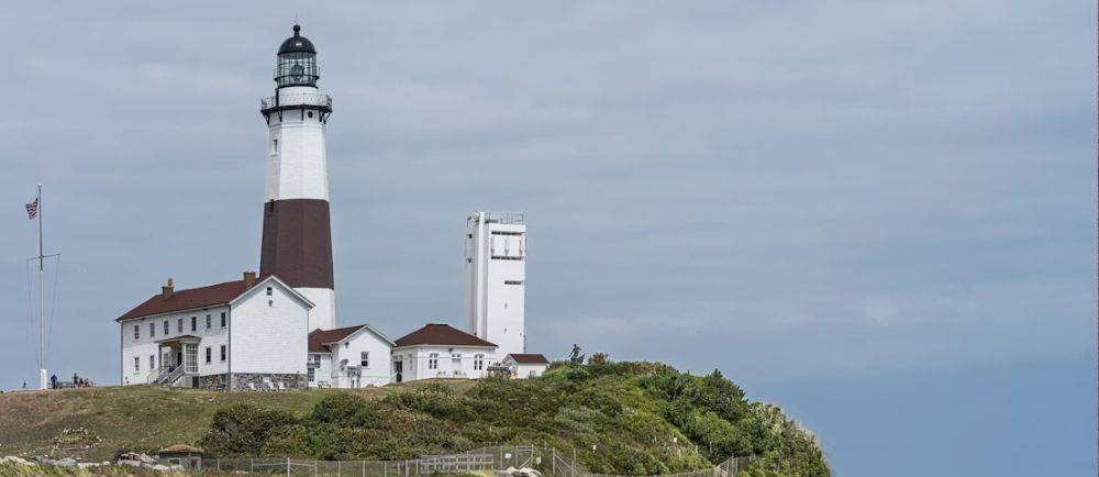 Montauk Point Lighthouse viewed from the rocky shoreline