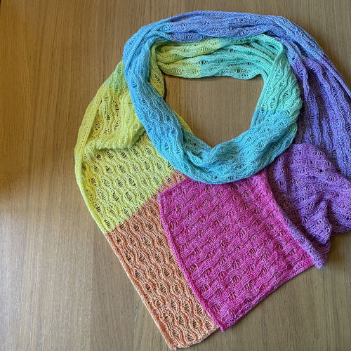 Knitted scarf Yvonne with dropped stitches and i-cord edge.