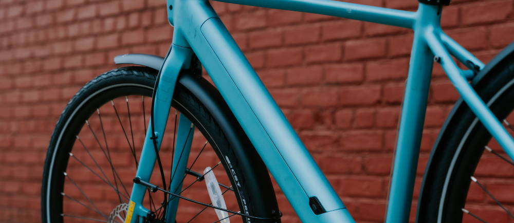 a sky blue Tenways electric city bike
