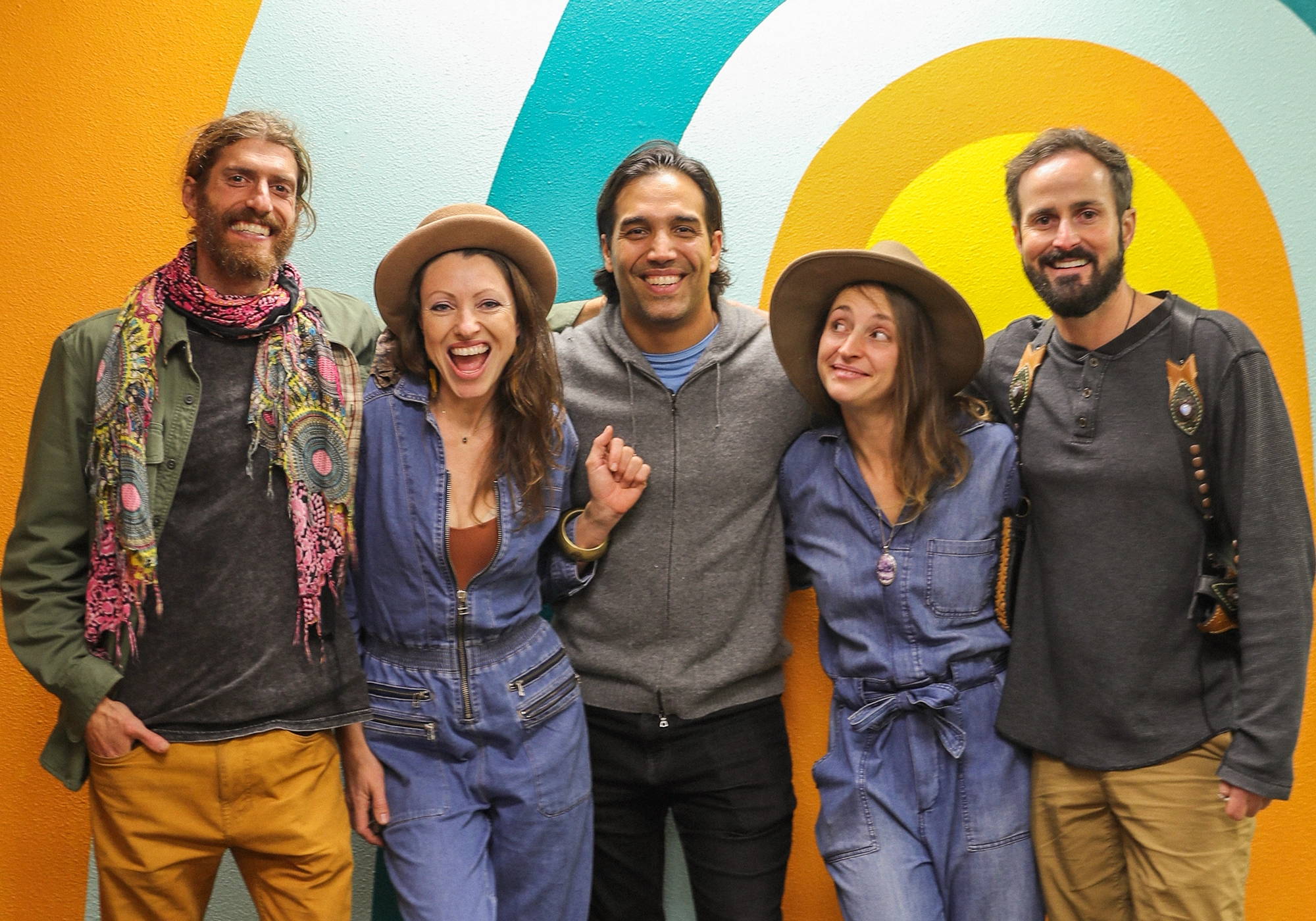 PACHA founders standing together and smiling for a team portrait.