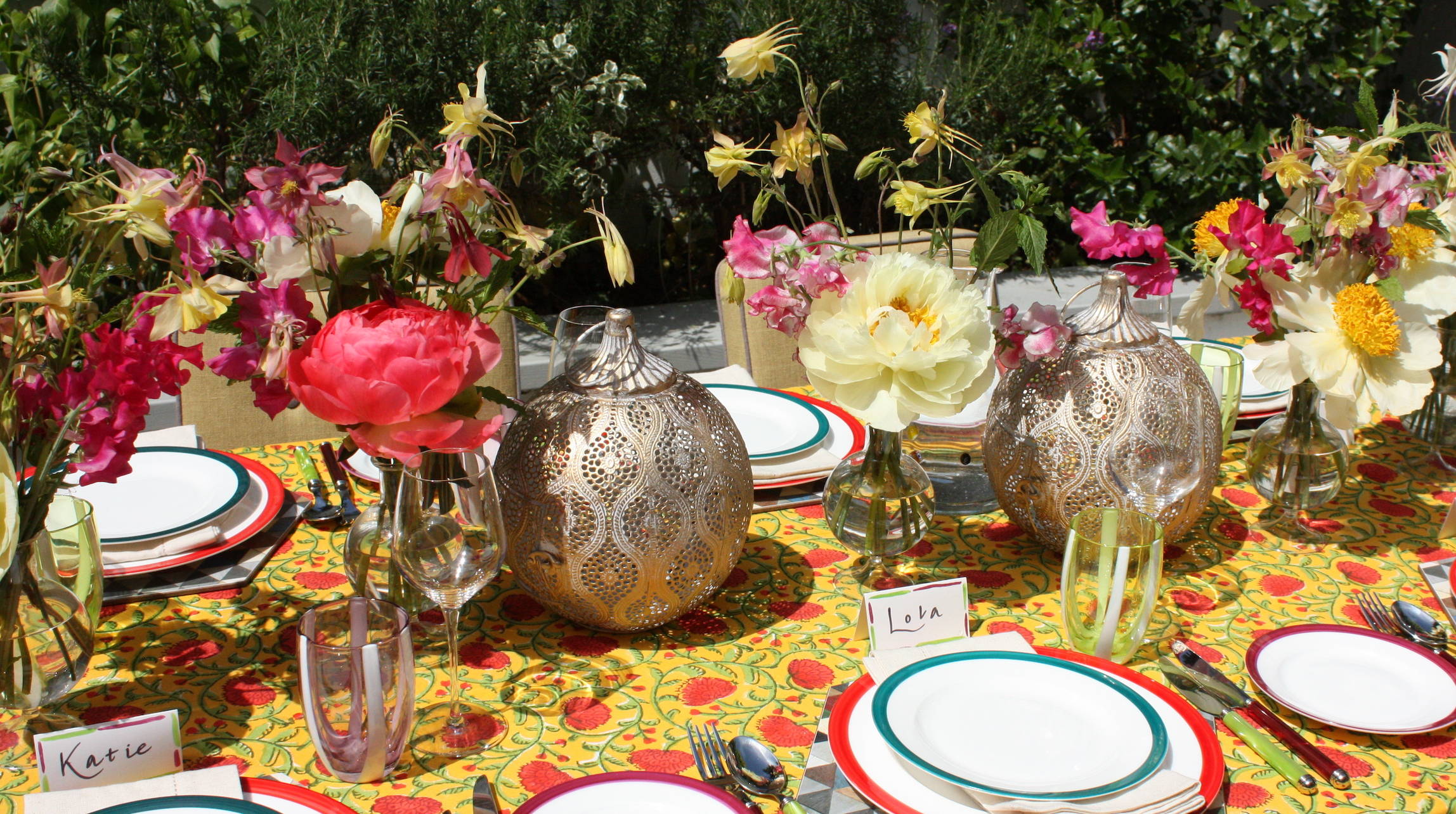 Bright fiesta themed tablescape with beatiful fresh flowers