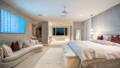 Soft interior lighting creating a calm bedroom space with layered illumination and warm tones
