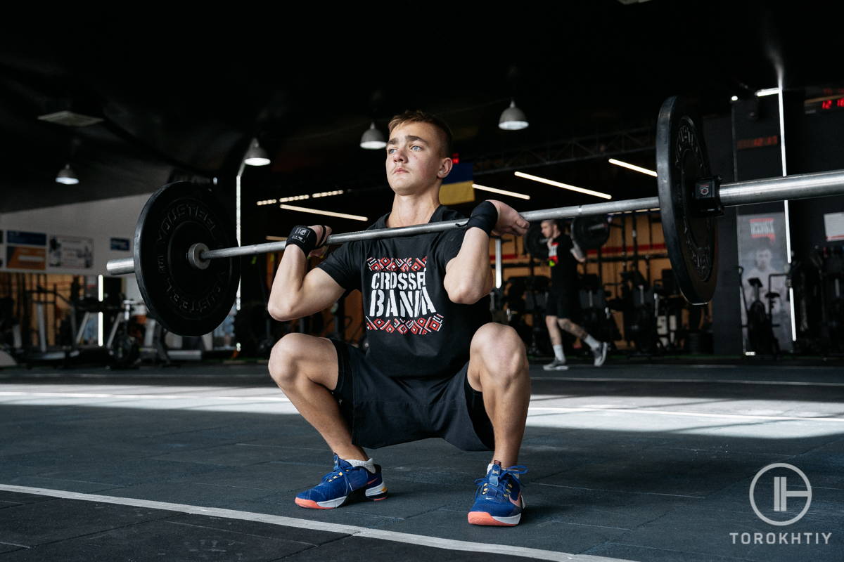 WBCM front squat performing by young man