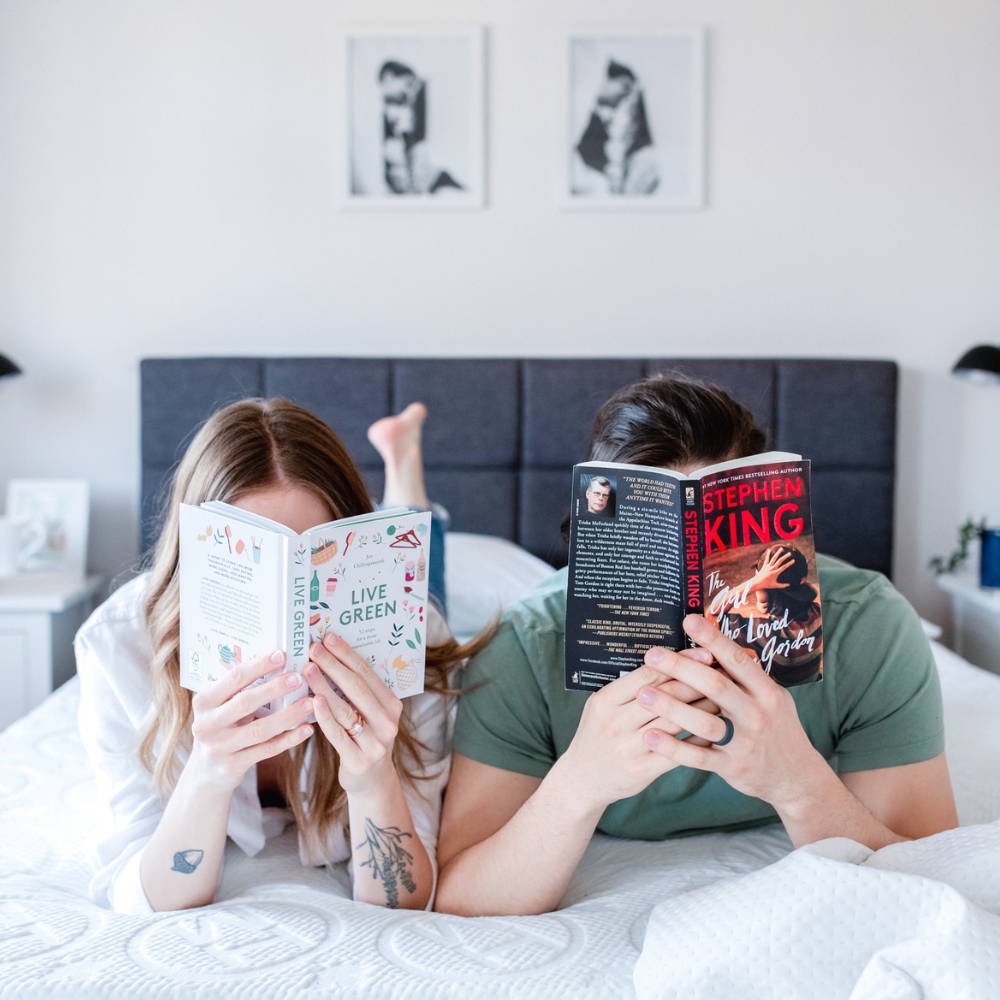 Couple sitting up in bed on a haven sleep co adjustable bed frame