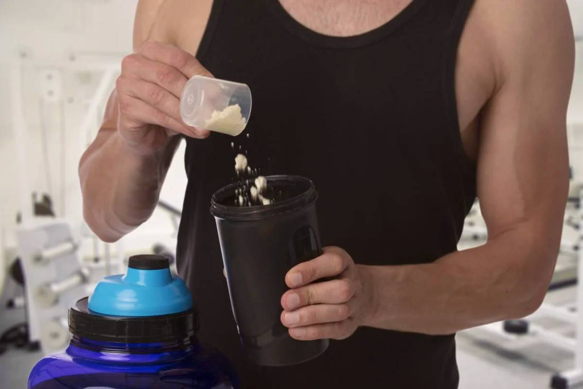 athlete making his protein shake