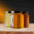 three-honey-jars-on-table