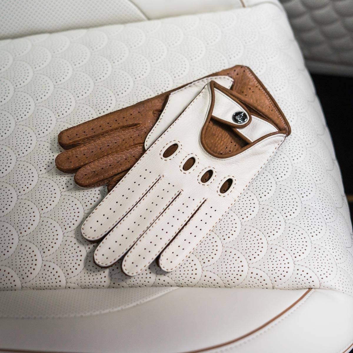 white brown driving gloves