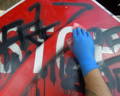 Using graffiti wipes to remove spray can paint easily and quickly