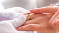 Jewelry Consultant holding ring bearers hand
