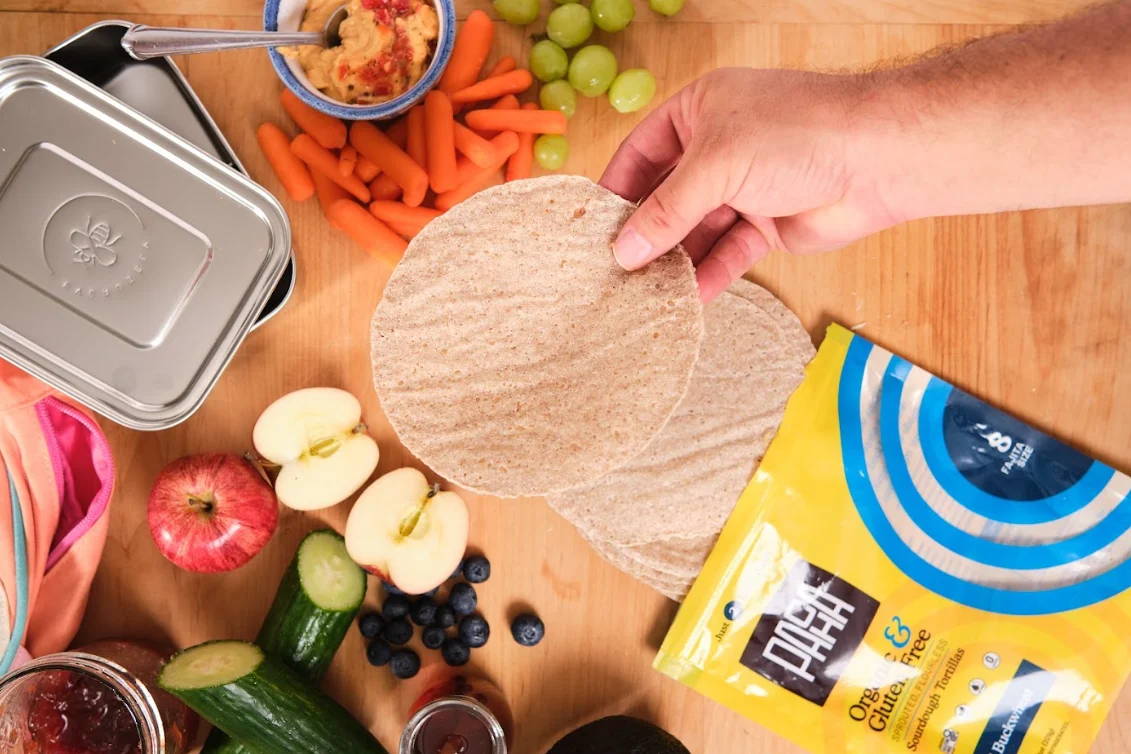 PACHA Tortillas on a background of fruits and vegetables