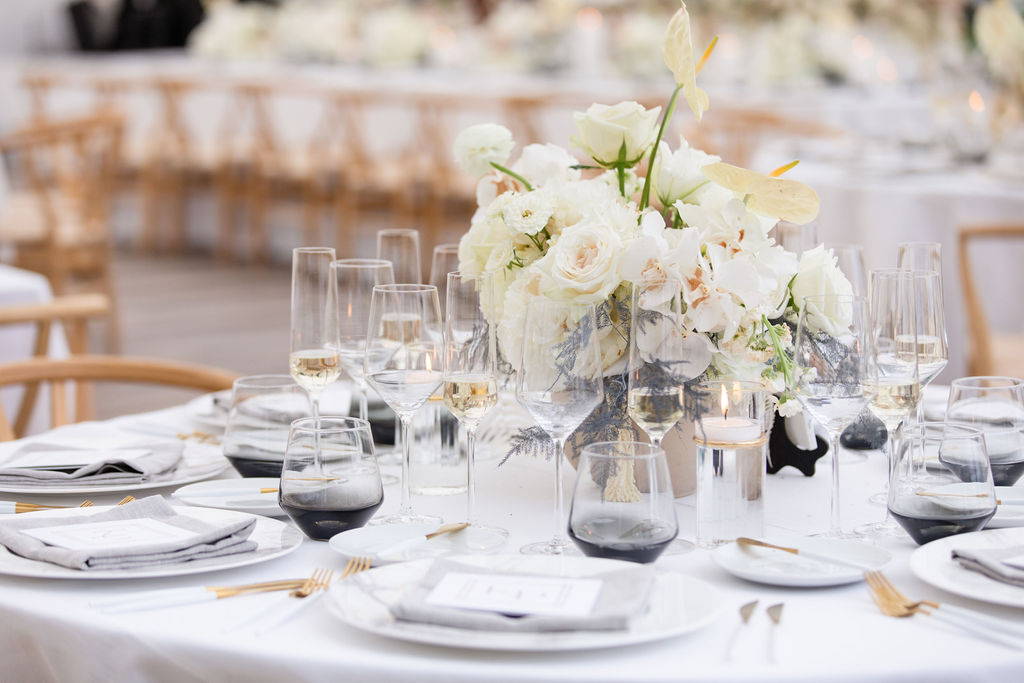 round guest table with white floral centerpiece