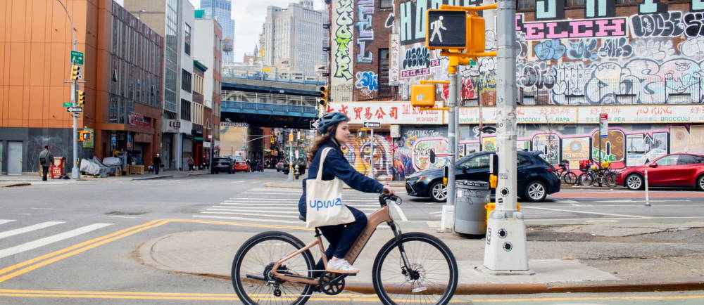 A woman on e-Bikes in China Town