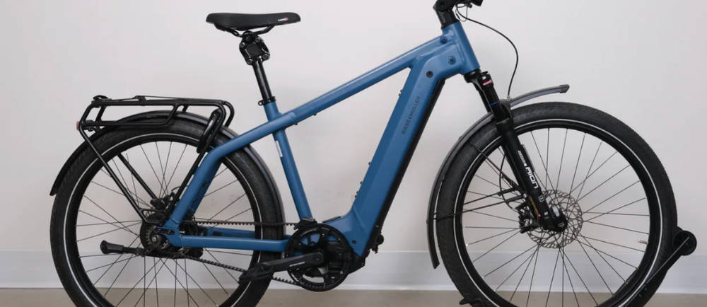 A blue Riese & Müller Charger4 GT Vario electric mountain bike
