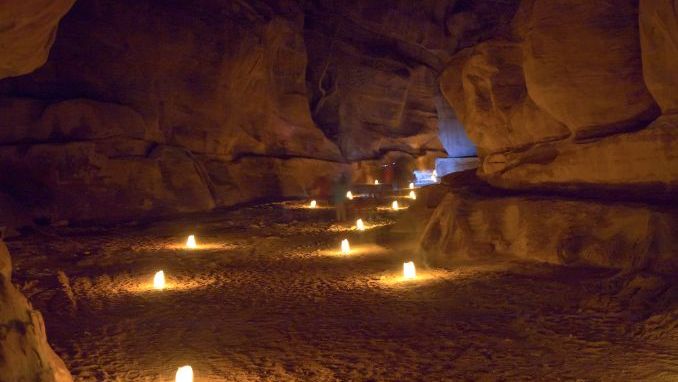 Narrow gorge The Siq in Petra at night