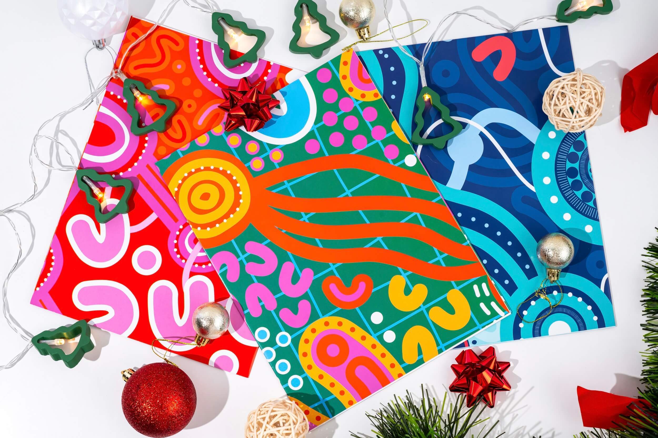 Gift wrapped in Aboriginal art wrapping paper under a Christmas tree