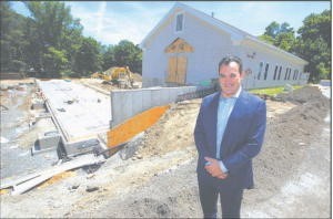 Rob Parsons poses outside of Primrose school of Chelmsford under construction