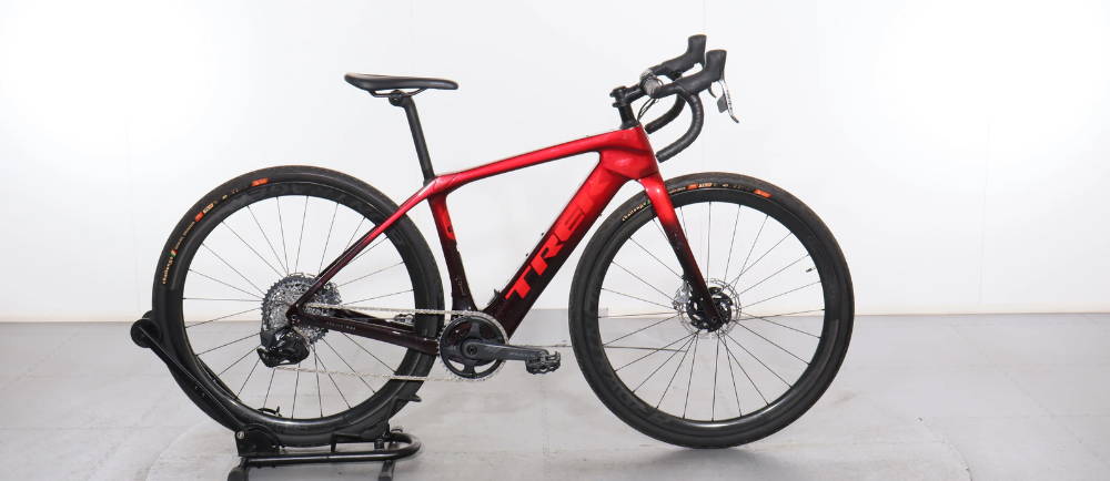 Trek road bike in front of sunset and lake