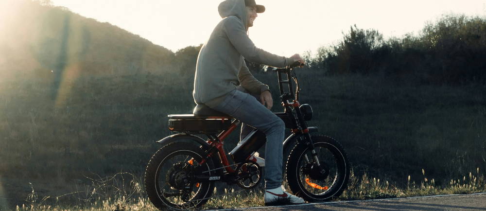 a man on a SUPER73 electric mini moto at sunsest