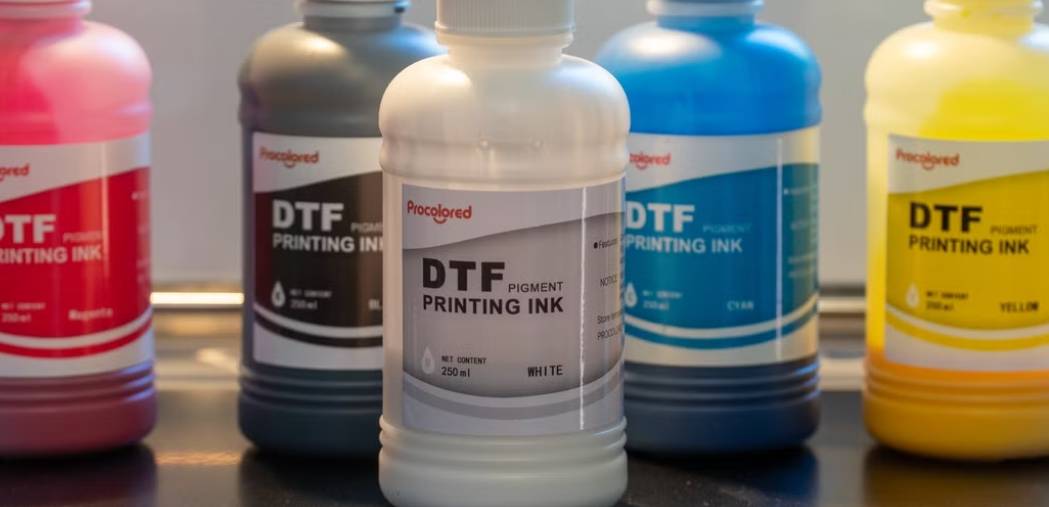 Essential DTF ink components: CMYK pigments, opaque white ink.