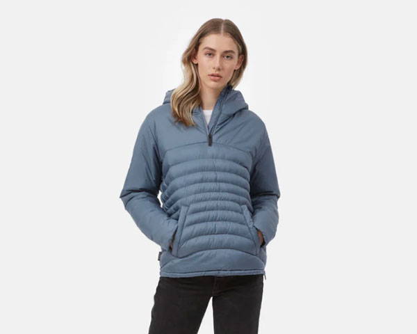 Woman wearing a light blue recycled insulated jacket from sustainable outdoor lifestyle brand Tentree