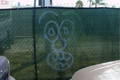 graffiti on hurricane and netted fencing 