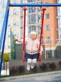 Girl on a traditional swing