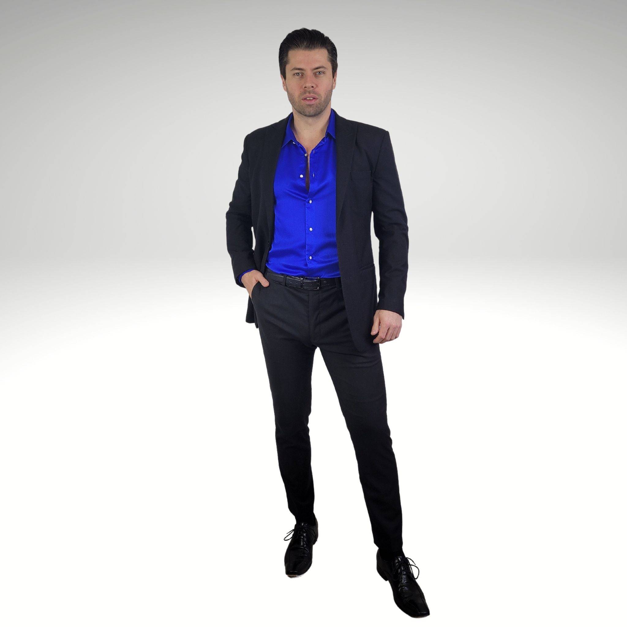 photo of a model wearing a blue long sleeve silk dress shirt underneath a black silk suit