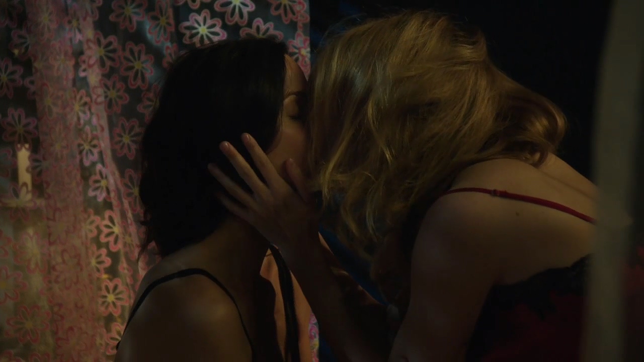 Amy and Saffron kissing passionately in Amy's bedroom.