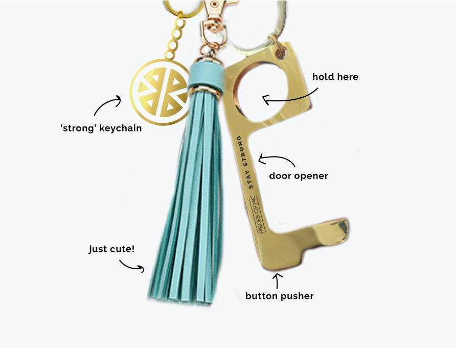 Gold no-touch tool that is a door opener, button pusher, and has a cute tassel