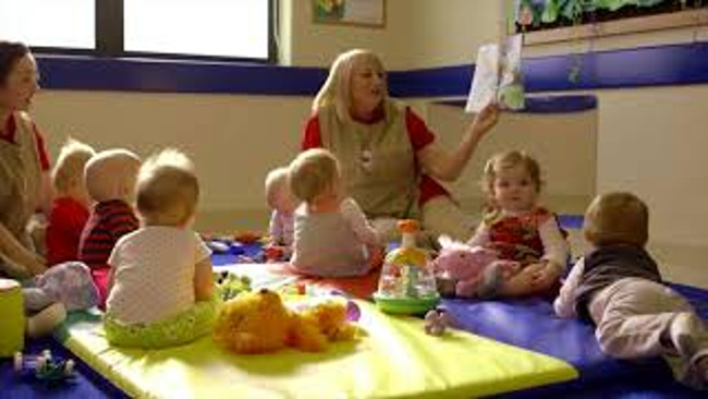 Teacher reading to Infants