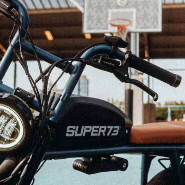 Super73 electric bike by a basketball hoop
