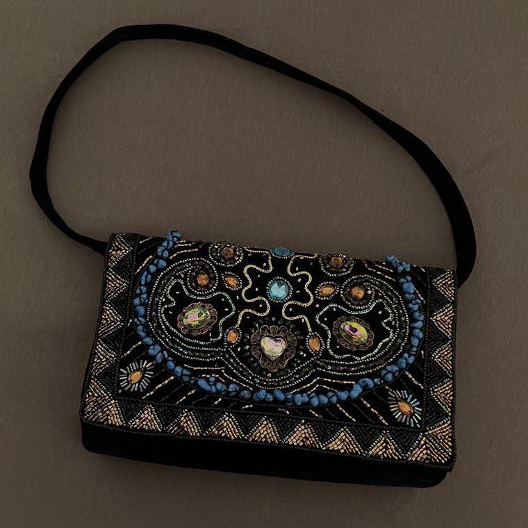 Clutch bag with charms