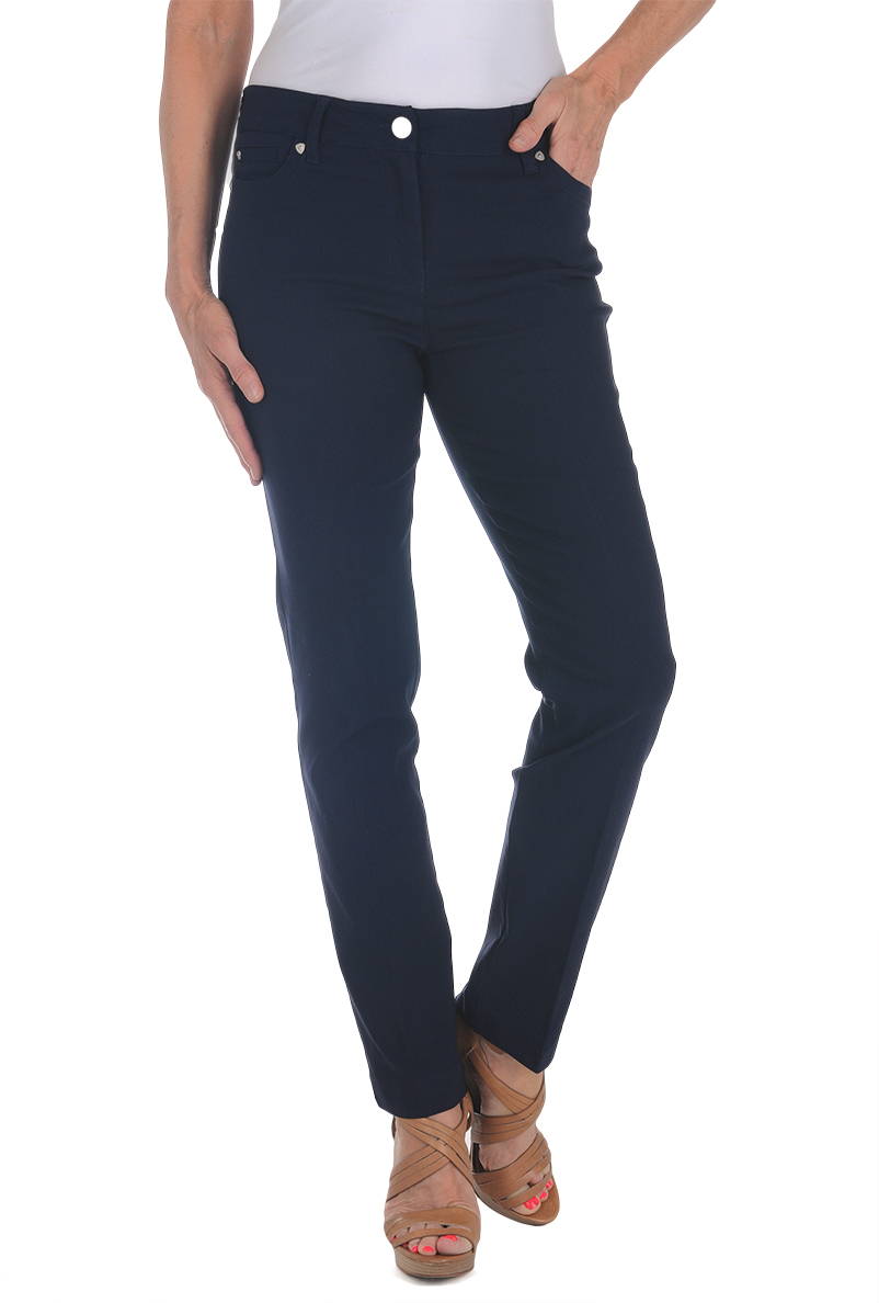 A woman wears a navy-colored full-length pant against a white background