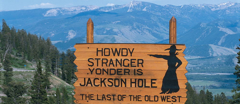 Jackson Hole sign in front of mountains