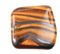 three smooth and polished tigers eye stones