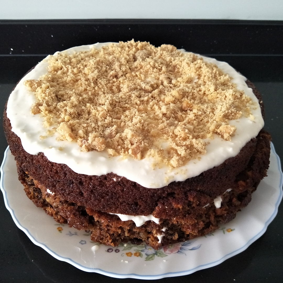 homemade sticky carrot cake with walnuts and cream cheese frosting