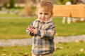 Alt text: Toddler outside in a jacket.