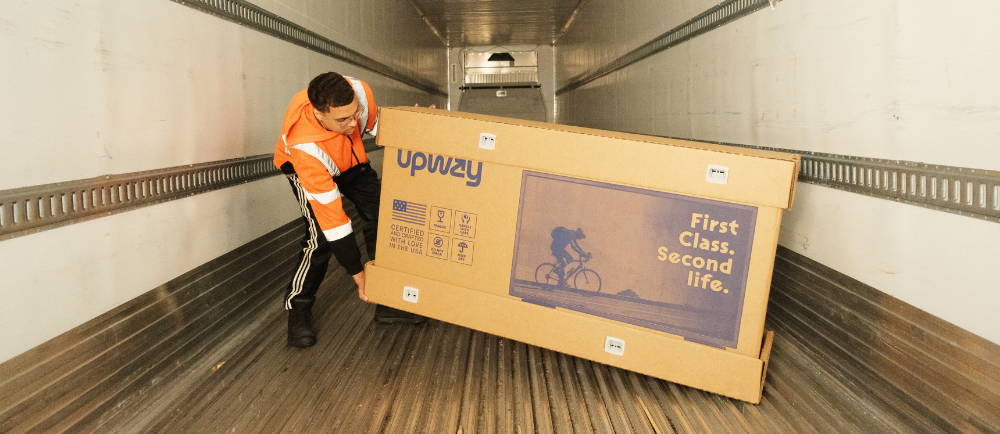 Upway bike box being loaded into a truck