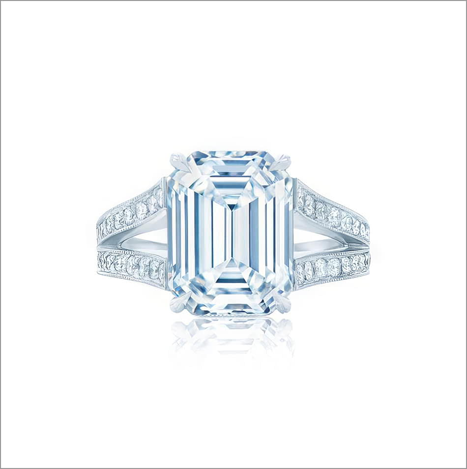 Front view of a Kwiat emerald cut diamond engagement ring on a contemporary band. 