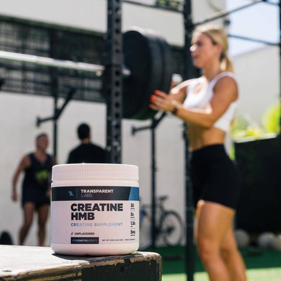 transparent creatine hmb on a table in gym transparent creatine hmb on a table in gym
