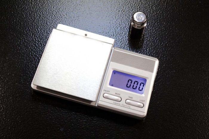 Digital Stylus Gauge shown with free calibration weight