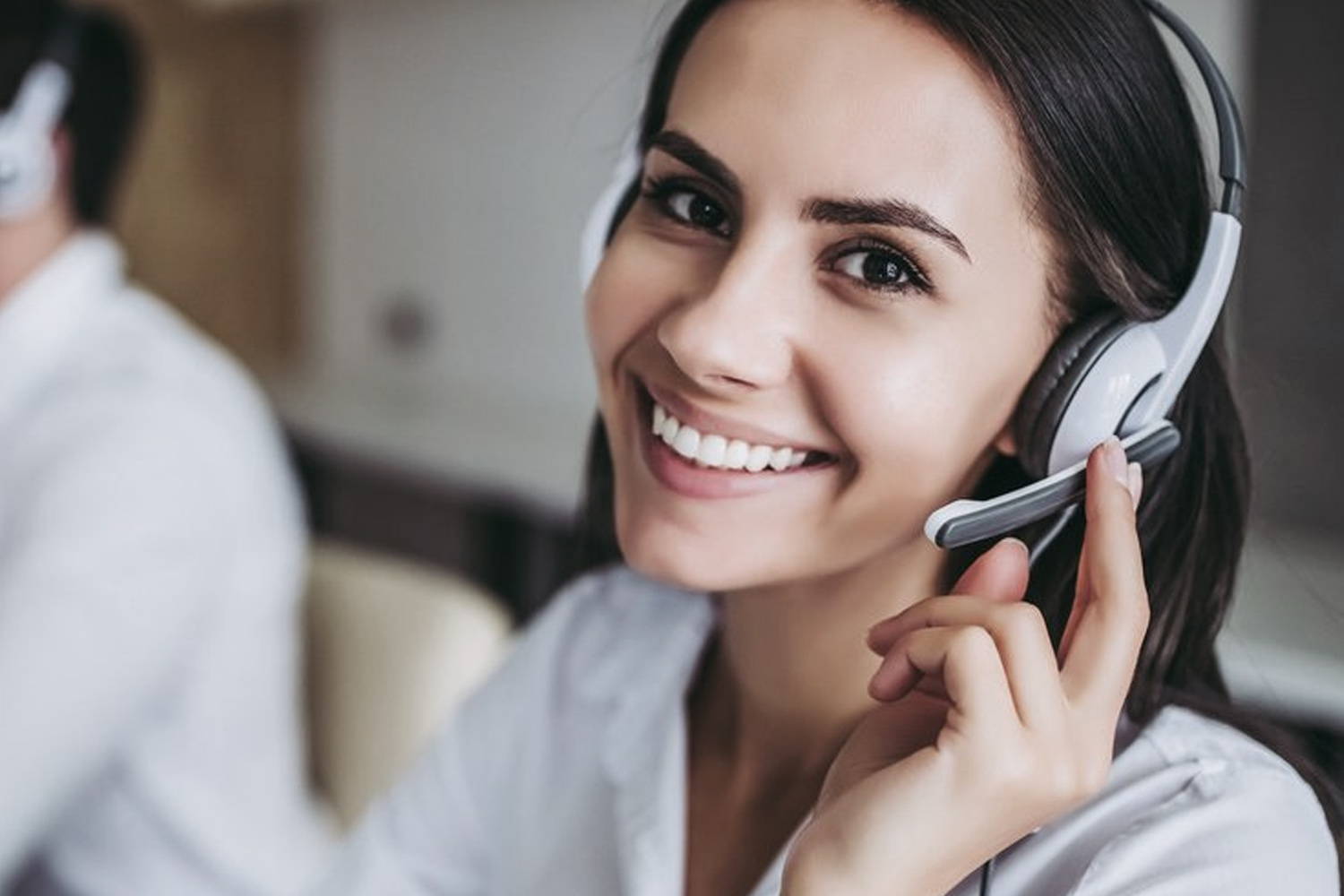 Image of Dremel DigiLab customer service representatives on a call and smiling 