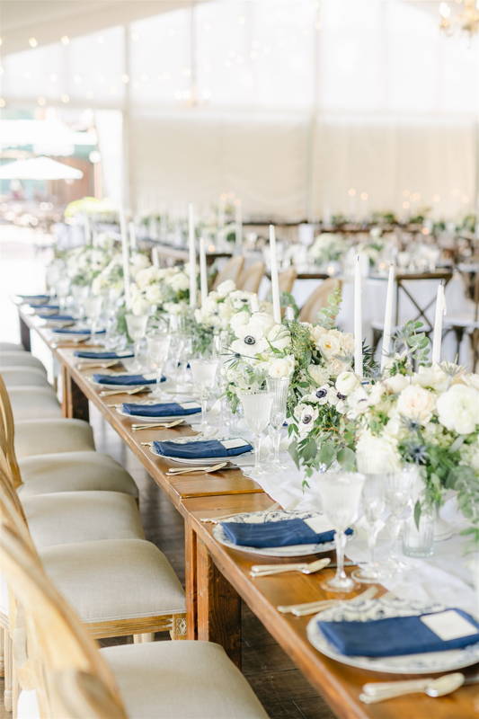 farm tables with white floral arrangements